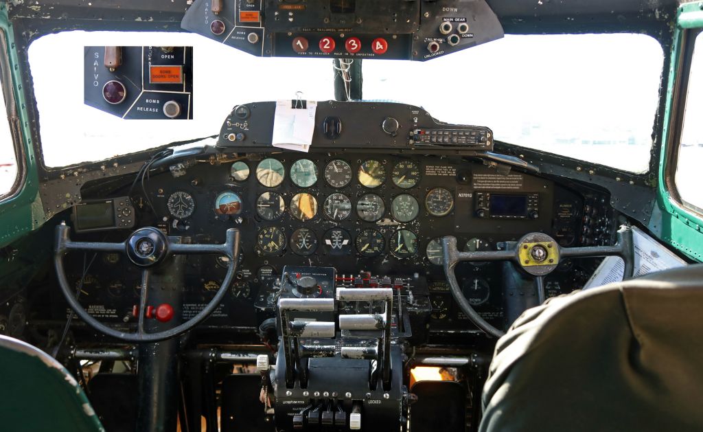 Boeing B-17 Flying Fortress (N3701G) - A snapshot showing the front office of The Liberty Foundations B-17 "Madras Maiden" (N3701G ... 44-8543A).  Although the cockpit of this Flying Fortress contains a mix of old and new navigational aids and flying controls, there are numerous WWII-era dials and instruments.  One of the more interesting areas in the cockpit can be seen along the top left center of the picture where the bomb bay doors switch, Bomb Doors Open light, Bomb Release button, and Bomb Salvo control box are all visible.  I have enlarged that part of the pic slightly and included the enlargement as an inset in order to permit a somewhat closer look at that area of the panel.