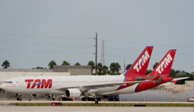 Airbus A330-200 (PT-MVC) - TAM A330-200 Reg#PT-MVB.Parked alongside!