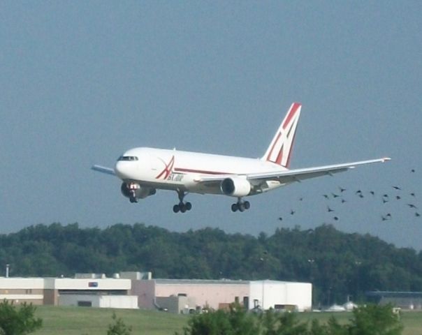 BOEING 767-200 (N740AX) - Abex 501 Heavy swooping down with a flock of birds for 18L.    Taken: 7/31/2010