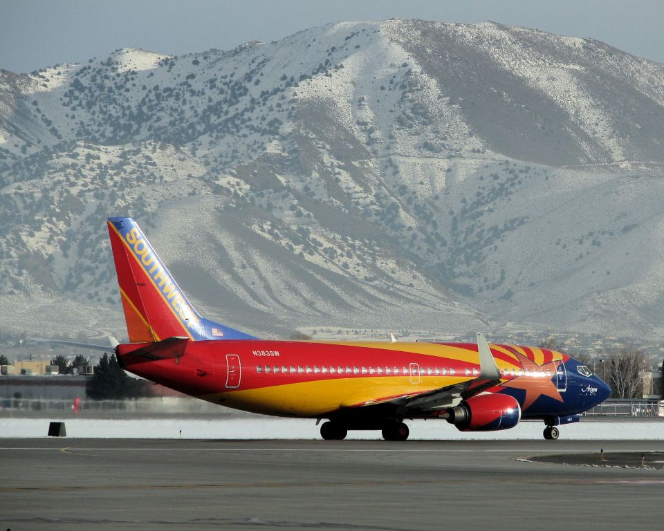 Boeing 737-700 (N383SW) - As the late afternoon sun begins to set over Reno for the final time in 2009, SWAs "Arizona One" starts its takeoff roll down runway 16R. (Photo taken: December 31st, 2009)