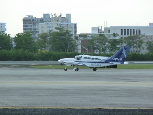 Cessna 402 (N402VN) - Cape Air Cessna 402 taxiing for departure from SJU runway 8 (on right side of the airctaft). 