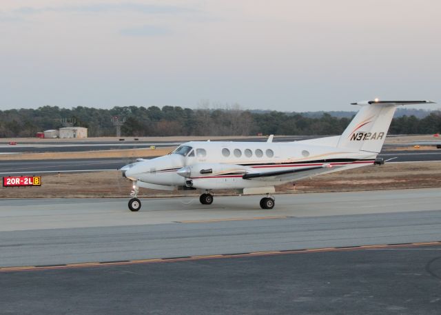 Beechcraft Super King Air 300 (N312AR) - Taxiing to ramp at PDK on 02/16/2011