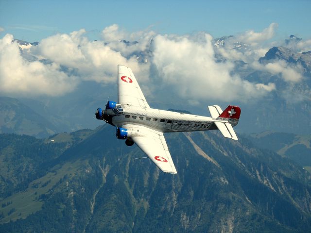 G4E — - Junkers 52/3m G4E (former HB-HOT / A-702, Swiss Airforce). Taken from mt. Pilatus, Switserland.