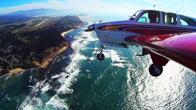 Beechcraft Bonanza (33) (N8943U) - Landing in Half Moon Bay RW 12 on a beautiful day.