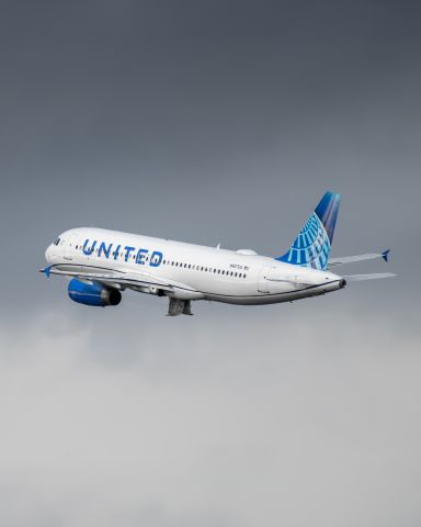 Airbus A320 (N407UA) - United A320 taking off from 23R at Raleigh Durham during cloudy weather as seen from the central parking deck