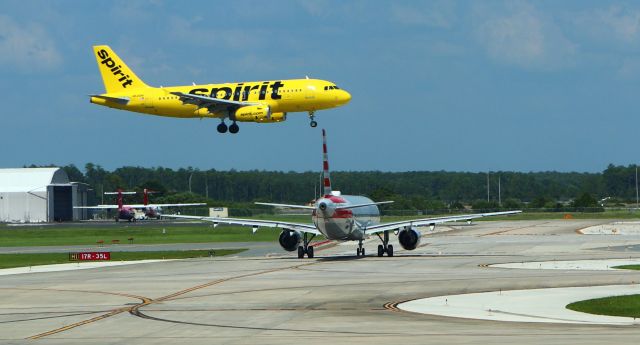 Airbus A319 (N536NK) - 6/14/23 Spirit inbound Rwy 17R as an AA bird waits