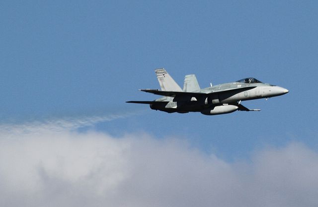 A2136 — - An RAAF Hornet blasts through a low cloud