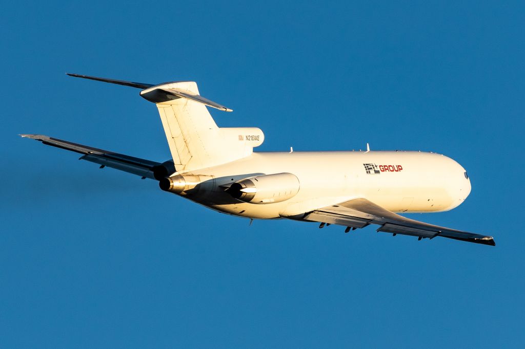 BOEING 727-200 (N216WE) - So happy with this shot! During peak season at SDF, I noticed this 727 departed everyday around 4pm. I waited for a sunny day, and amongst the hundreds of UPS departures, got this 727 banking off of runway 17R in some stunning lighting!