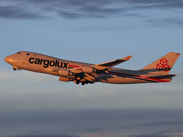 Boeing 747-400 (LX-KCV) - Early morning take-off with the sunrise glistening on this beautiful aircraft.