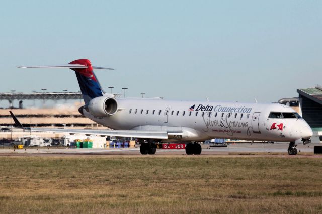 Canadair Regional Jet CRJ-700 (N738EV) - "Silver & Soaring" Celebrating ASAs 25 Years (01-02-2011)