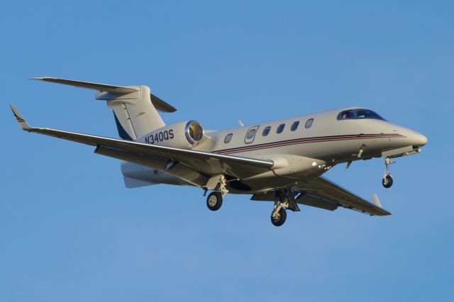 Embraer Phenom 300 (N340QS) - 22 approach just before sunset.