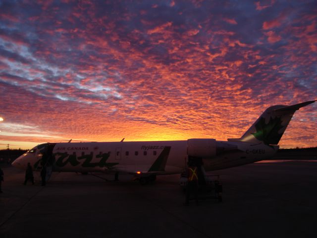 Canadair Regional Jet CRJ-200 (C-GKEU) - Air Canada Jazz CRJ-200 loading up under a spectacular morning sky at Fort McMurray, Alberta, Canada, October 23rd, 2007.