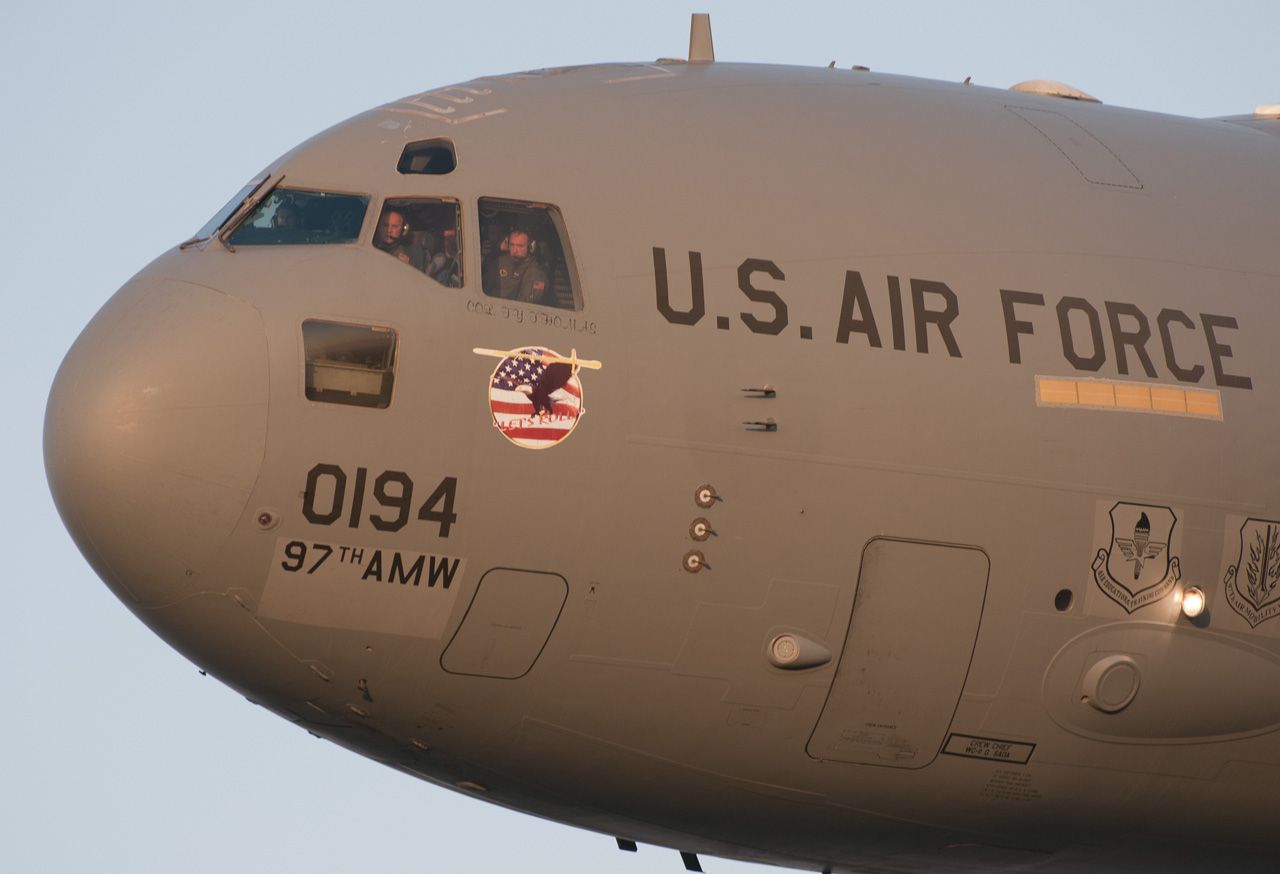 Boeing Globemaster III — - Air Force cargo Heritage flight practice over Houston, TX. Shot from AC-47 "Spooky" Gunship