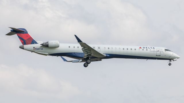 Canadair Regional Jet CRJ-900 (N897SK) - A CRJ-900LR glides in for a landing on runway 18/36 at KSBN.