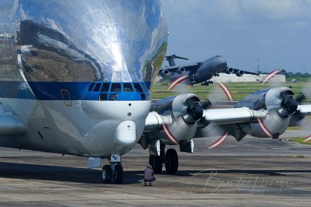 N941NA — - NASA's infamous B377SGT Super Guppy is having a SUPER day was the Dover C5M Super Galaxy departs in the background.