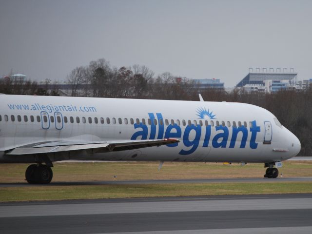 McDonnell Douglas MD-83 (N886GA) - Taxiing to runway 2 with the Charlotte Motor Speedway in the background - 12/8/14