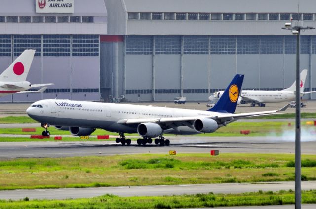 Airbus A340-600 (D-AIHT) - Was this a good landing? All the wheels facing a different direction! And there was NOT a drop of wind! 