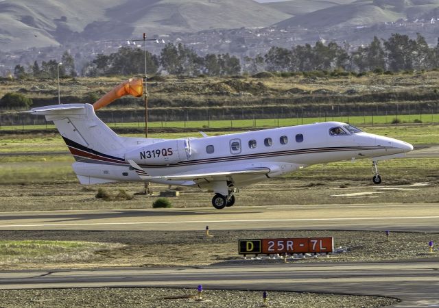 Embraer Phenom 300 (N319QS) - Net Jet Embraer Phenom 300 departs Livermore Municipal Airport (CA). February 2021.