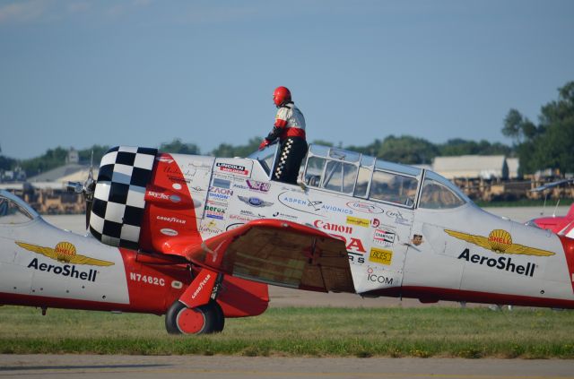 North American T-6 Texan — - EAA 2011 Aeroshell team member on climb out. Get it? On climb out... OK give me a break, its 2300 hours, this is the last of 41 pictures downloaded and I really should be sleeping since I work tomorrow. Seriously, thanks for looking at my pictures!