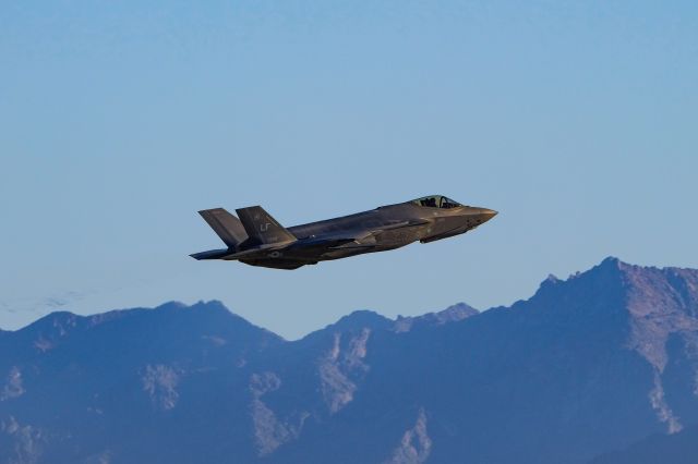 — — - F-35A departing 3R. Sierra Estrella Mountains in the background