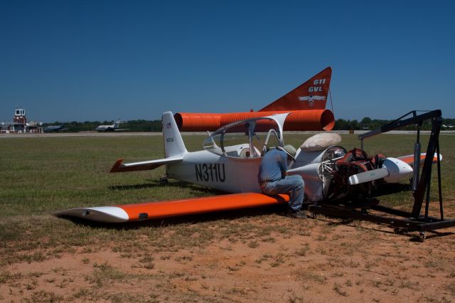 Vans RV-4 (N311U) - After loosing one of the two wheels under the wings, this aircraft crash landed.  The remains were moved off the paved surface and the pilot was given the opportuinty to disassemble the aircraft  and remove it.