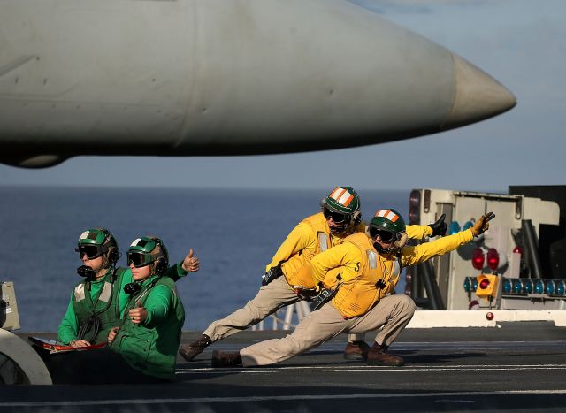 — — - AT SEA- DECEMBER 10:  A flight deck crew prepares to launch a F18 Super Hornet from the deck of the USS Eisenhower off the coast of Virginia, December 10, 2015 in the Atlantic Ocean. US Defense Secretary Ash Carter visited the carrier with Indias Minister of Defense Manohar Parrikar to demonstrate US Navy aircraft carrier flight operations.  (Photo by Mark Wilson/Getty Images)