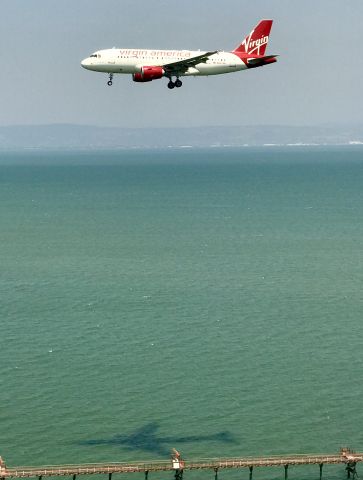 Airbus A319 (N527VA) - Shooting from my window aboard United 737 on parallel approach to 28L KSFO