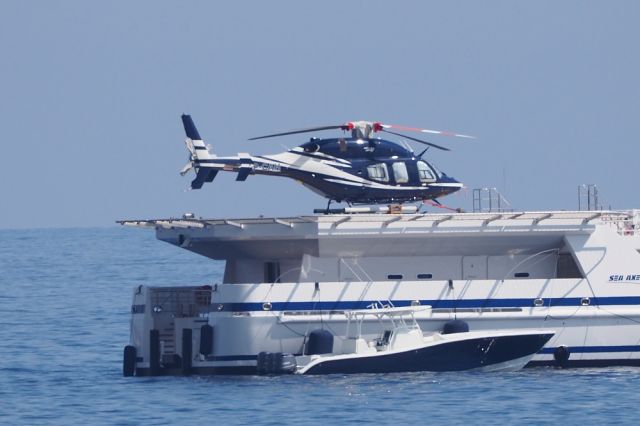 Bell 429 GlobalRanger (VP-CAH) - 26 aug 2017 - bay od Monaco on desk of supply vessel GARCON