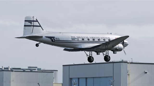 Douglas DC-3 (N877MG) - Historic Flight Foundations new DC3C on final approach to runway 16R on 2/27/13. (Ser#4193).