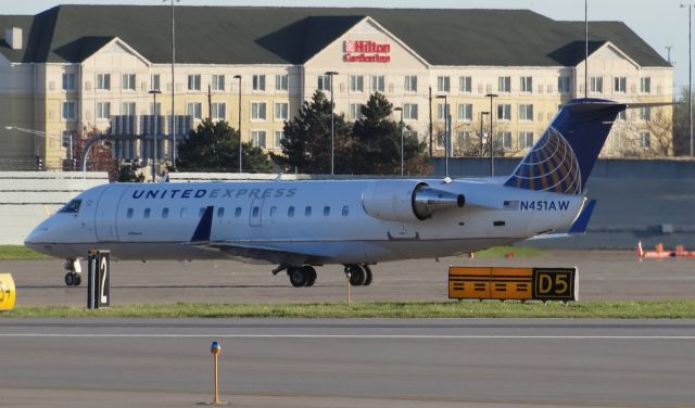 Canadair Regional Jet CRJ-200 (N451AW) - CRJ200 pulling into the ramp with the Hilton Garden Inn in the background