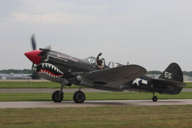 NL977WH — - With a very nice wave from the Curtis P-40 Warhawk.  