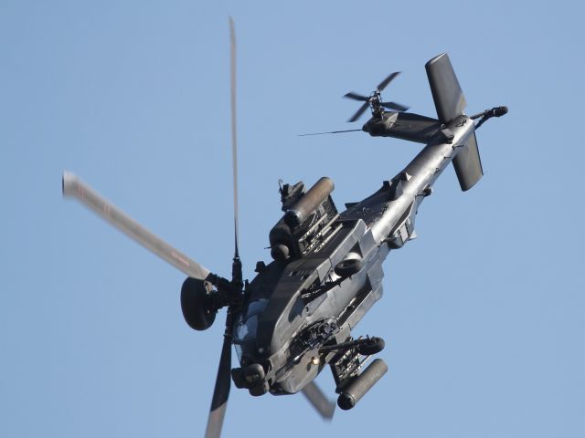 — — - An RAF Boeing Apache runs through extreme manourvers during it's aerial display at RAF Waddington.