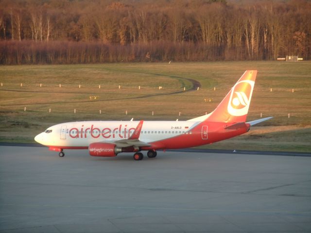 Boeing 737-700 (D-ABLD) - Air Berlin B737-700(WL) D-ABLD taxiing after landing on 14L to terminal in a golden afternoon sunlight. CGN airport, 14.12.2014.