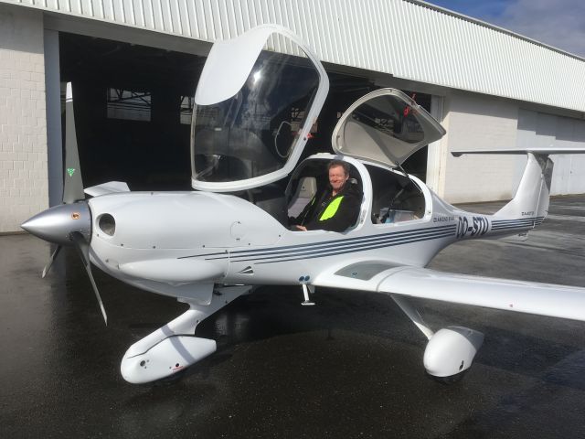 OO-STU — - Owner seated in aircraft outside hangar on North side of airport.