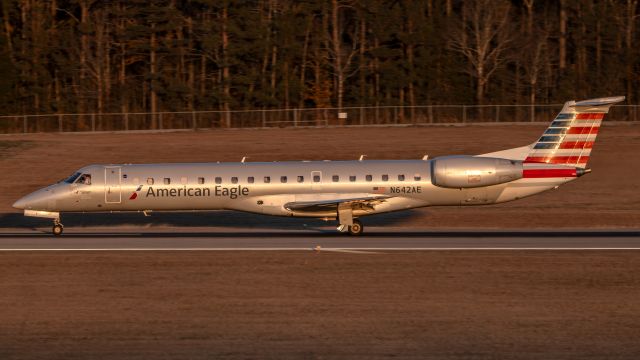 Embraer ERJ-145 (N642AE) - Gorgeous 25 year old E145 departing for CLT during the last gleams of the day's sunlight