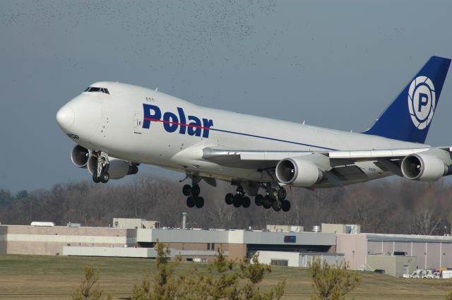 Boeing 747-400 (N453PA) - polar 946 heavy landing on 18L with a flock of birds    this photo was picked by the staff    I can be reached at Truck10FMFD@aol.com for questions or comments