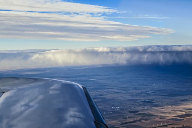 Cessna 350 (N63TE) - Off of wingtip, cold front crosses the Texas Panhandle