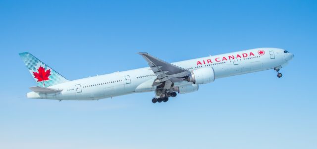 BOEING 777-300 (C-FIVM) - Some conflicting information on this aircraft in the activity log, even calling this an E190!! Climbing off runway 06L at YYZ on a cold clear day. 