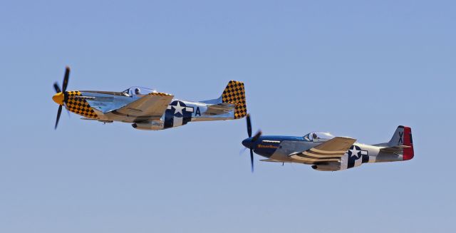 North American P-51 Mustang (N451EA) - A pair of North American P-51D Mustangs, N451EA "Primo Branco" in the lead and N546OV "Straw Boss 2" (L) "Little Sandra" (R), make a final pass at the 2022 Truckee Tahoe Airport Air Show & Family Festival on Saturday, 23 July, before departing and heading back home.