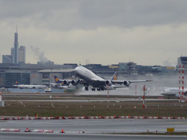 BOEING 747-8 (D-ABYP) - Lufthansa B747-8 D-ABYP taking off from 25L FRA, 27.01.2019. Look at the vorticities on the wings.