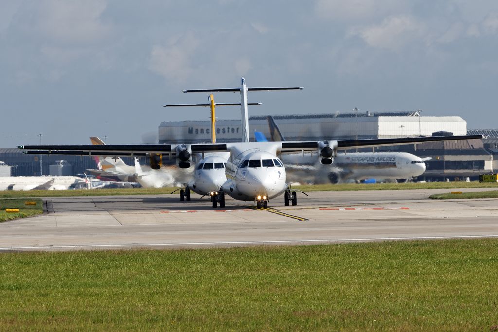 ATR ATR-72 (EI-FMK) - EIN3721 to Cork awaiting her turn to depart, followed by an Aurigny ATR72.br /br /EOS6D, 70-300 f4-5.6L @ 300mm, 1/125, f16, ISO100