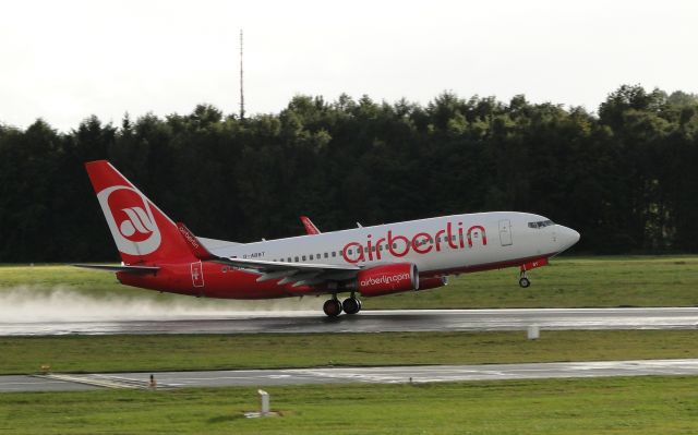 D-ABBT — - Air Berlin Boeing 737-76N on a rainy runway in Hamburg, Germany.