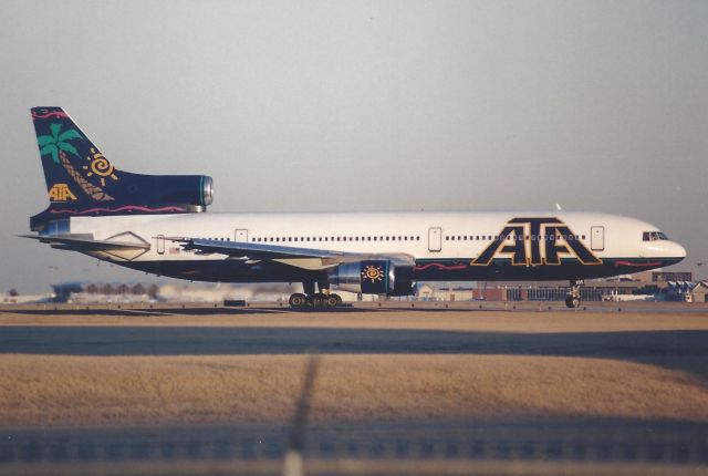 Lockheed L-1011 TriStar (N186AT) - Taking the runway (Runway 14) for departure.