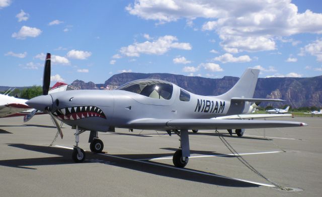 Lancair Legacy 2000 (N181AM) - 2012 Lancair Legacy with "Flying Tiger" logo on nose and displayed at Sedona AZ.  Like many Legacies, this one is frequently seen flying over many parts of USA.