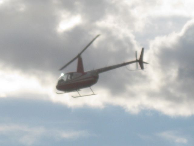 Robinson R-44 (N7086L) - Departing to the southwest.