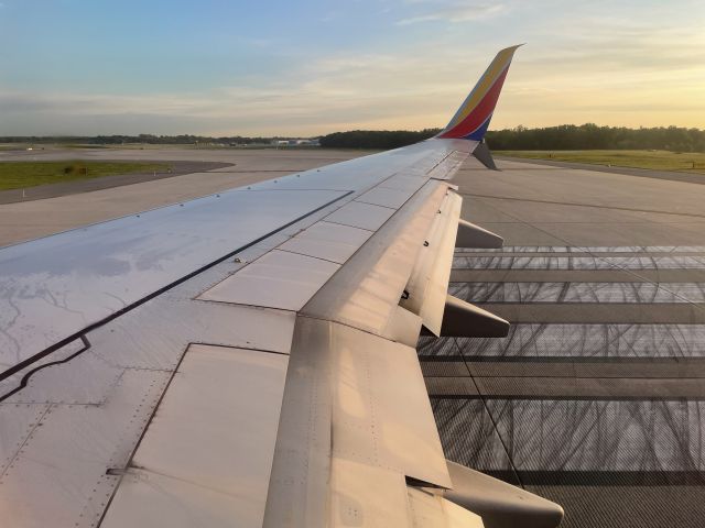Boeing 737-800 (N8679A) - Lined up on 28 just after sunrise for a flight to Tampa