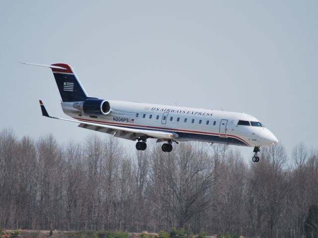 Canadair Regional Jet CRJ-200 (N206PS) - Approaching runway 18C - 3/11/09
