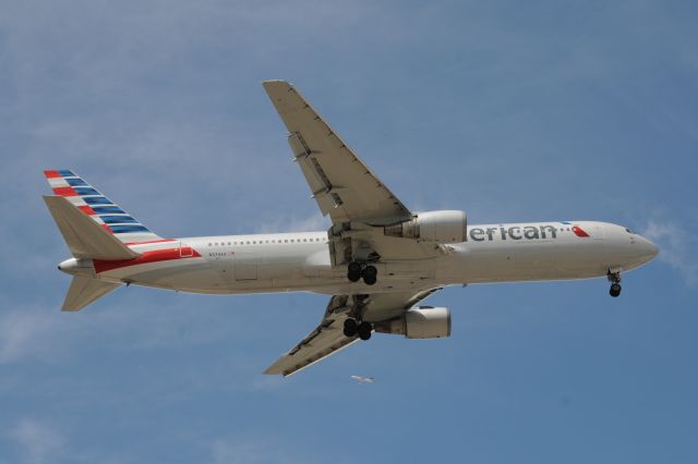 BOEING 767-300 (N374AA) - Short final for Runway 10-R at ORD on 07-23-13