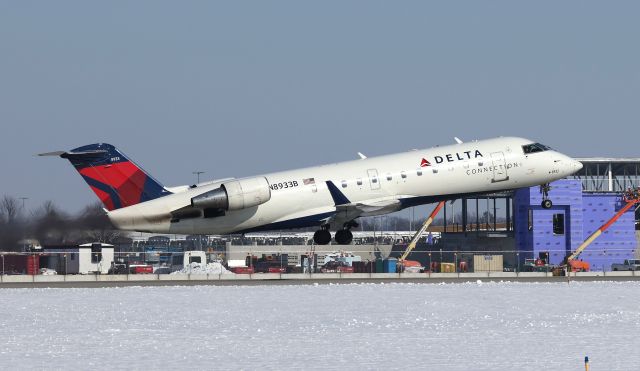 Canadair Regional Jet CRJ-200 (N8933B) - Taking off on runway 14