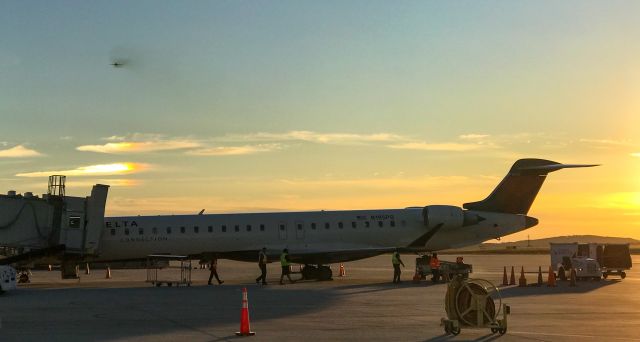Canadair Regional Jet CRJ-900 (N195PQ) - Sunset against a beautiful sky with a departing MD-88 in the background.